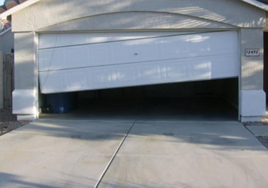garage door off track repair in in Chatsworth